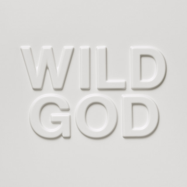 Nick Cave & The Bad Seeds — Wild God, 2024. The album that brought Cave back to something that isn't quite joy but resembles it from certain angles. Produced with Warren Ellis; ten tracks; approximately eighty minutes of festival preparation required.